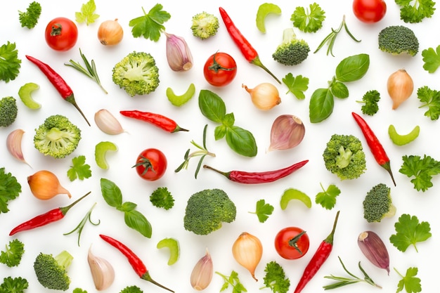 Vegetable and spices isolated on white background, top view. Wallpaper abstract composition of vegetables.