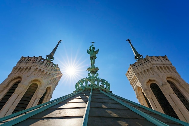 View of SaintMichel statue on the top of notredamedeFourviere basilica in Lyon