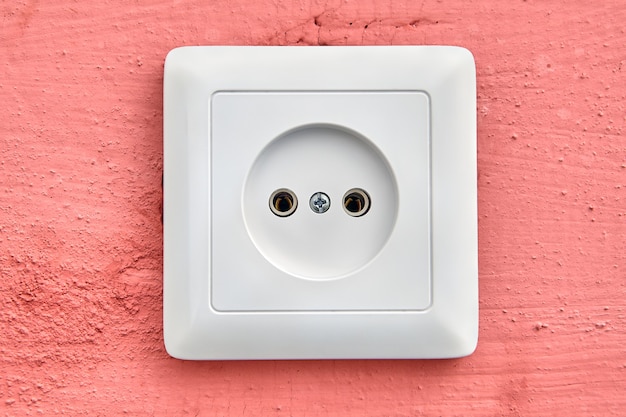 Wall outlet of European type, square-shaped.