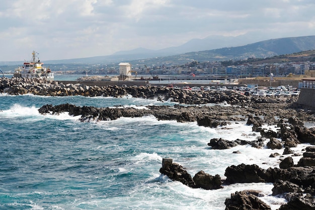 Waves crash on the rocky beach forming splashes Waves and splash on the beach