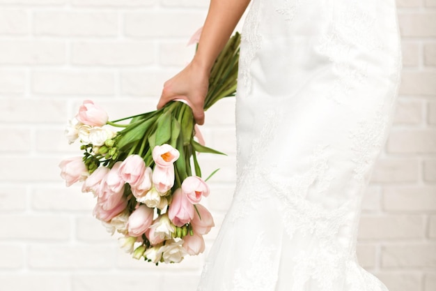 Wedding bouquet of tulips in bride's hands