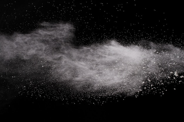 White powder explosion on black background.  