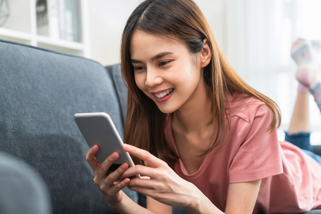 Woman holding a smartphone and using online social on lifestyle. Technology for communication concept.