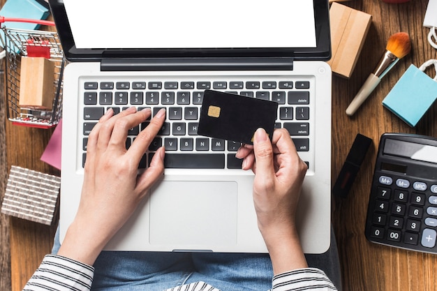 woman is using a computer to shop online