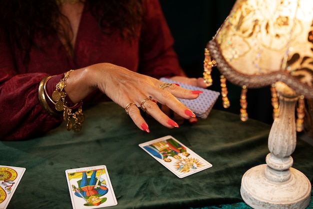 Woman with tarot cards front view