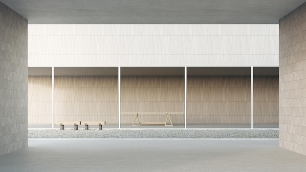 Wooden wall with concrete terrace near empty gravel floor courtyard.