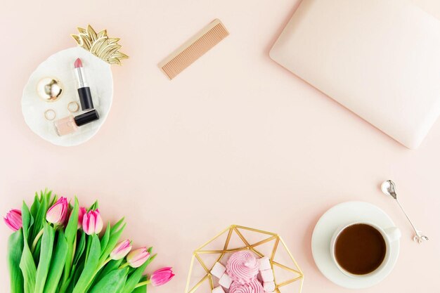 Photo workspace with laptop woman hands on pastel pink background flat lay top view office table desk