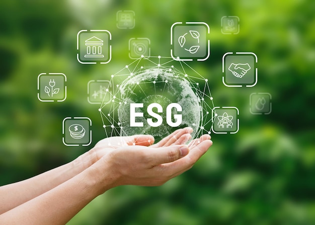 Photo world sustainable environment concept hand of human holding esg icons for environment social and governance on network connection