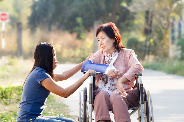 Young asian is taking care the senior woman ,Thailand