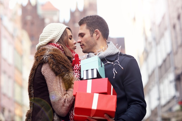 young couple doing Christmas shopping in the city