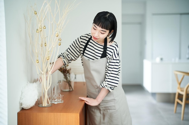 Young woman cleaning the room