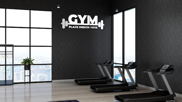 PSD 3d gym logo mockup in the fitness area with the black wall for athlete