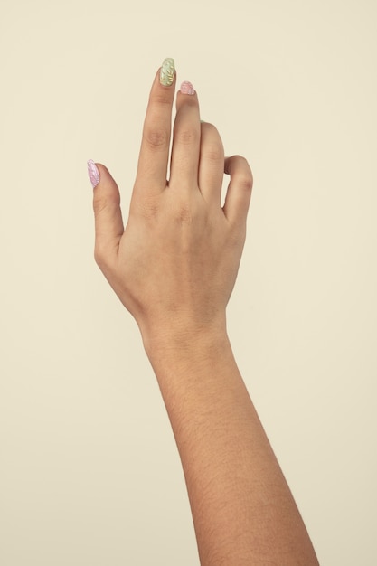 Adult woman hand with nail polish