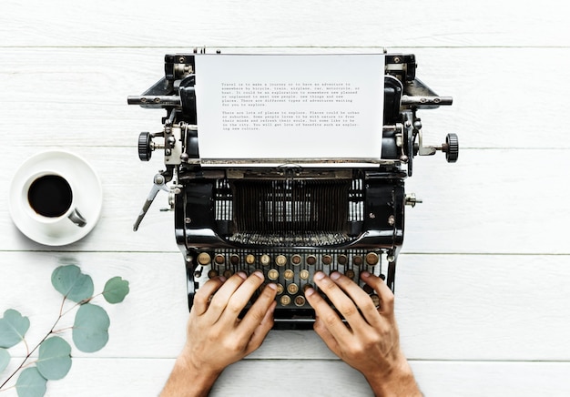 PSD aerial view of a man typing on a retro typewriter