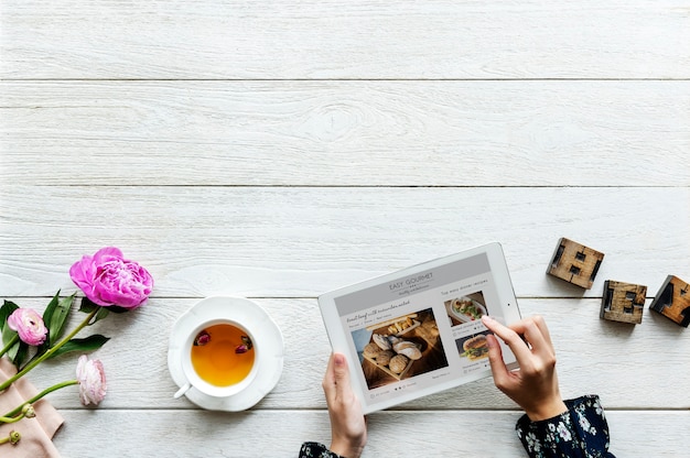 PSD aerial view of a woman using digital tablet cooking hobby concept