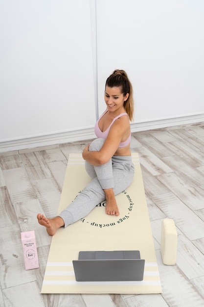 Athletic woman doing yoga at home