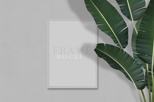 Blank picture frame for photographs art graphics with Leaves Frame mockup template on the background texture 3D rendering