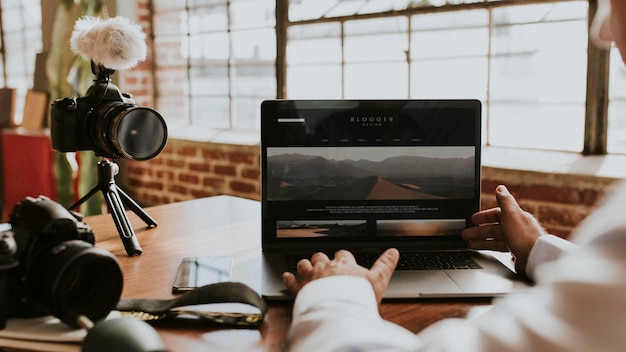 PSD blogger filming himself while using a laptop mockup