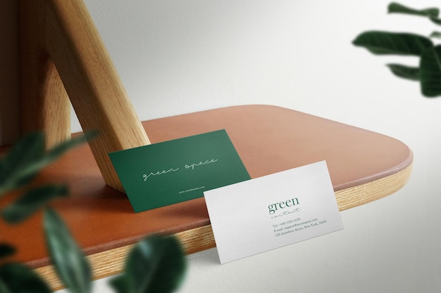 PSD clean minimal business card mockup below the table background