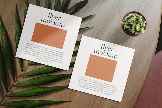 PSD clean minimal square flyer mockup on table background with leave and plant