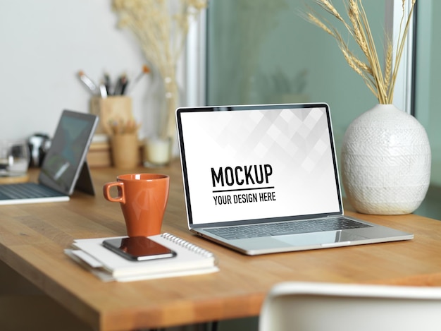 Close up view of workspace with laptop mockup