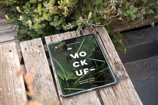 Device mockup on patio with plants