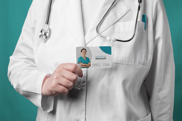 PSD doctor holding business card front view