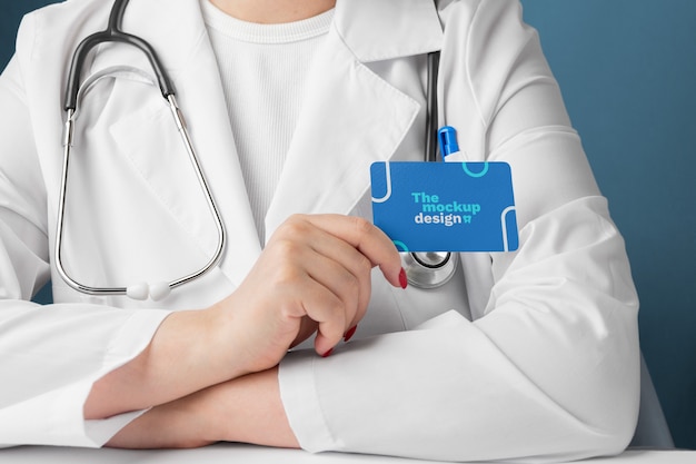 PSD doctor holding business card front view