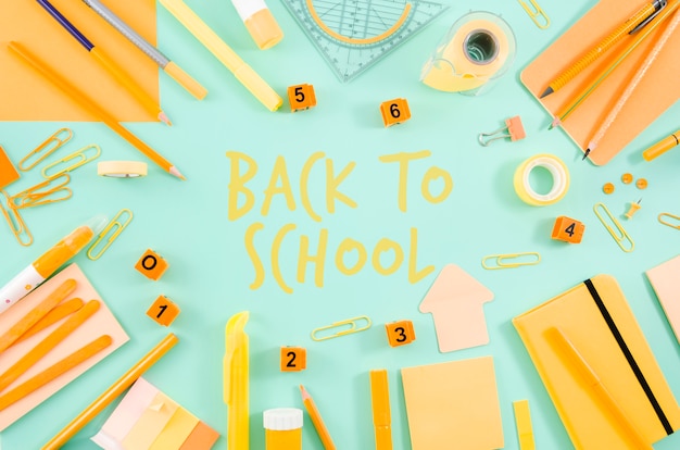 Flat lay back to school with yellow supplies