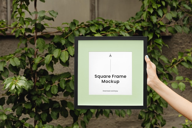 Frame with Hand Mockup