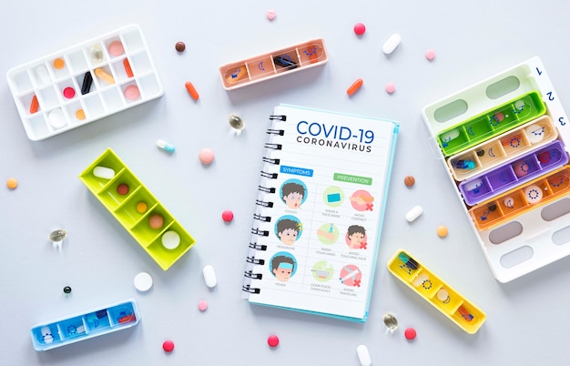 PSD mock-up notebook beside pills