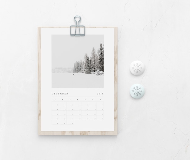 PSD mock-up wooden board with calendar on wall