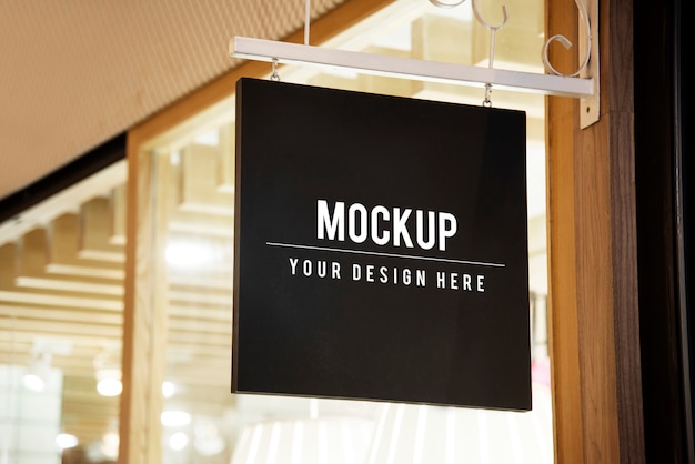 PSD mockup sign outside of a shop