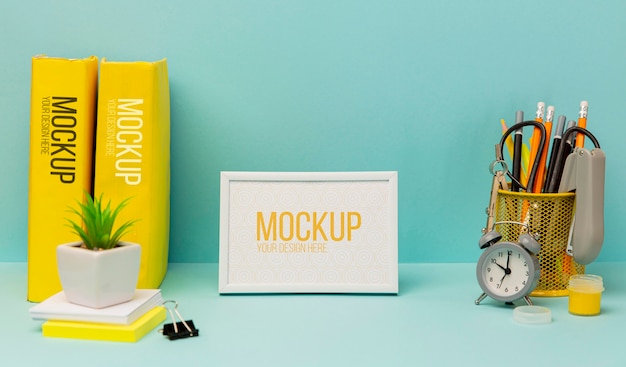 Pencils and alarm clock with mock-up