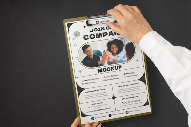 Person holding document mock-up with clipboard