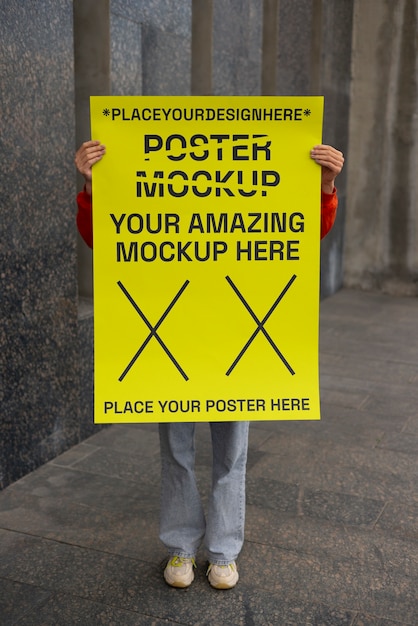 Person holding poster mockup