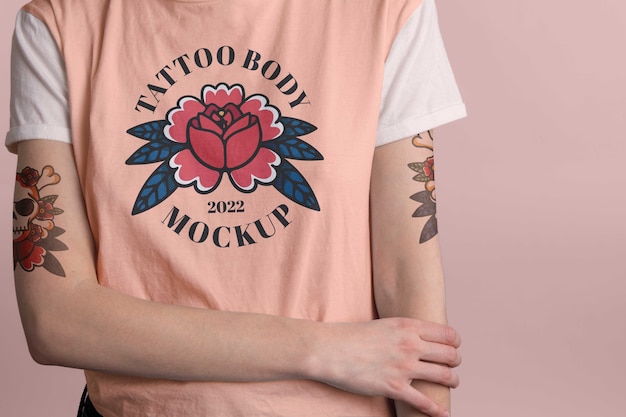 Person with tattoo mock-up on arms and t-shirt