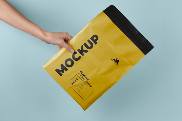 Plastic post pack mockup held in hands