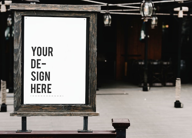 PSD rustic wooden signboard mockup at a restaurant