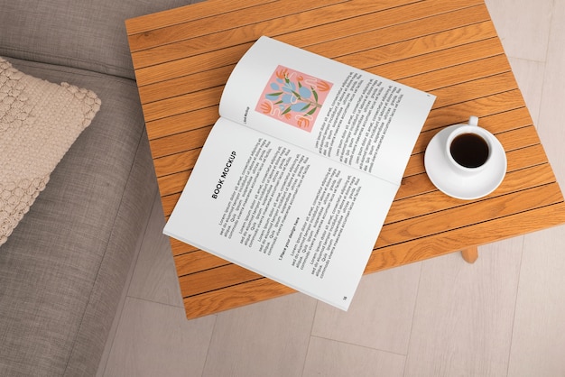 Top view on wooden furniture with book mockup