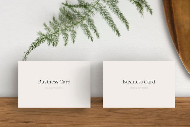 White Business Card Mockup Template Design Lean on Plain Wall