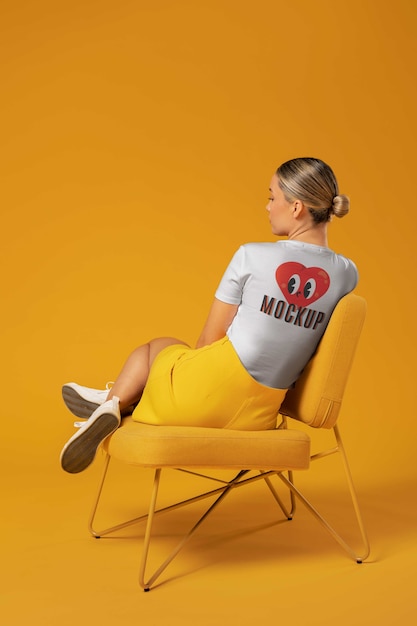 Woman sitting on chair full shot