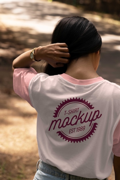 Woman wearing shirt mock-up outdoors in nature