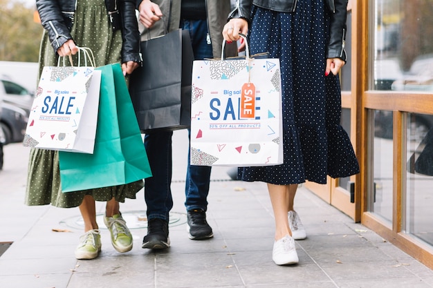 PSD women with shopping bags in city