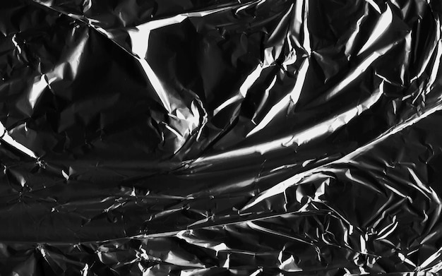 Vector abstract transparent plastic wrap wrinkled texture on black background vector illustration