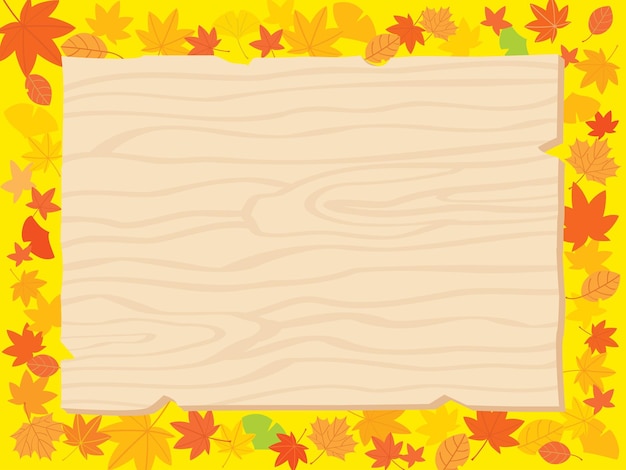 Autumn fallen leaves and wooden bulletin board.