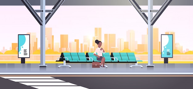 Vector businesswoman sitting modern bus stop   woman checking time waiting public transport on airport station cityscape background  horizontal full length