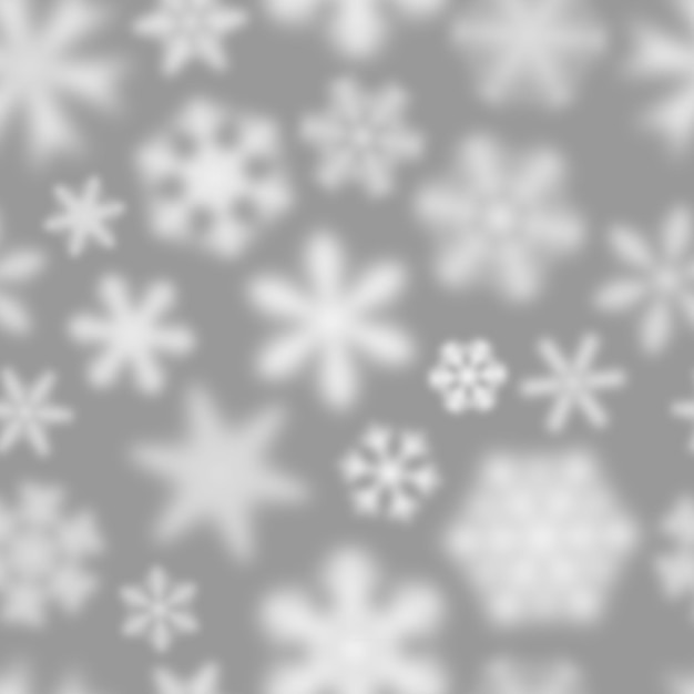 Christmas seamless pattern of white defocused snowflakes on gray background