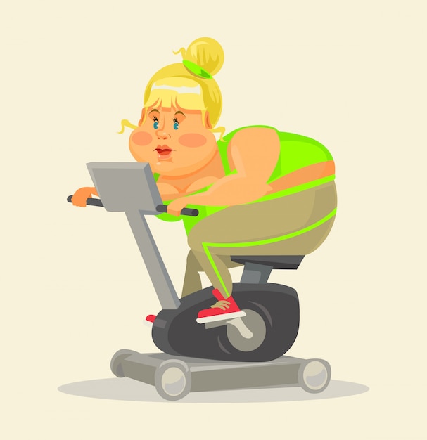 Fat woman in gym. Fat woman on exercise bike