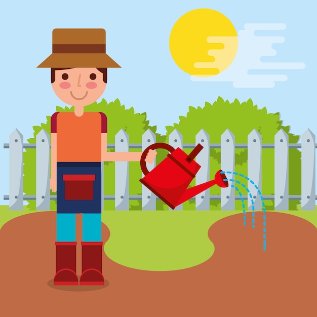 gardener boy watering garden fence bush